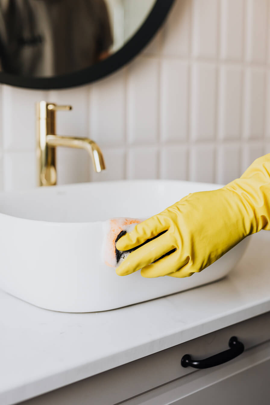 Professional deep cleaning with yellow gloves